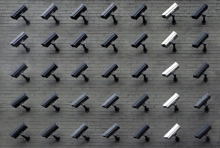 Professional security camera installation team at work